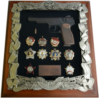Панно с макетом пистолета Стечкина и наградами СССР